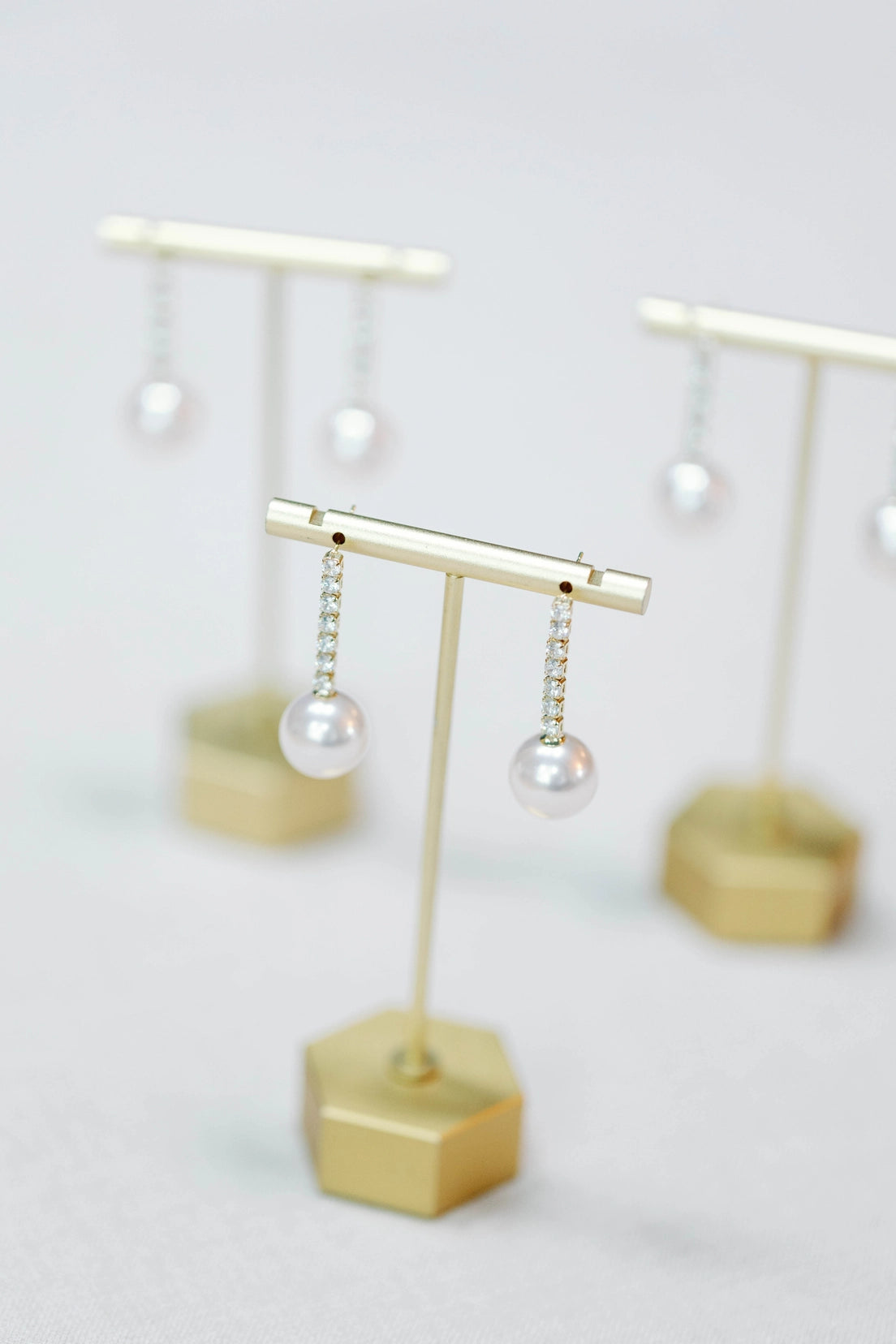 Small Swingy Pearl and Diamond Statement Drop Earrings | St Armands Designs of Sarasota